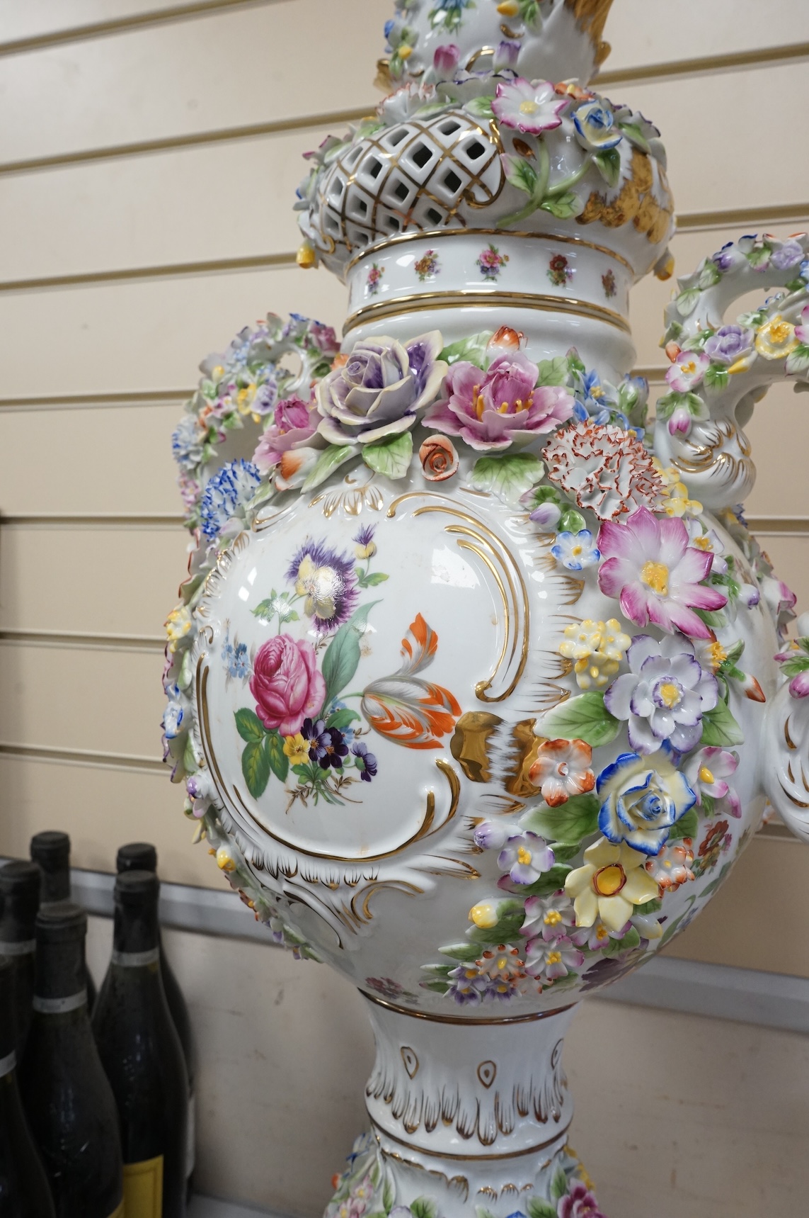 A large 20th century German porcelain two-handled pedestal vase and cover, 89cm